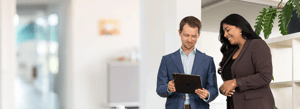Two people working on legal compliance requirements with Eticor